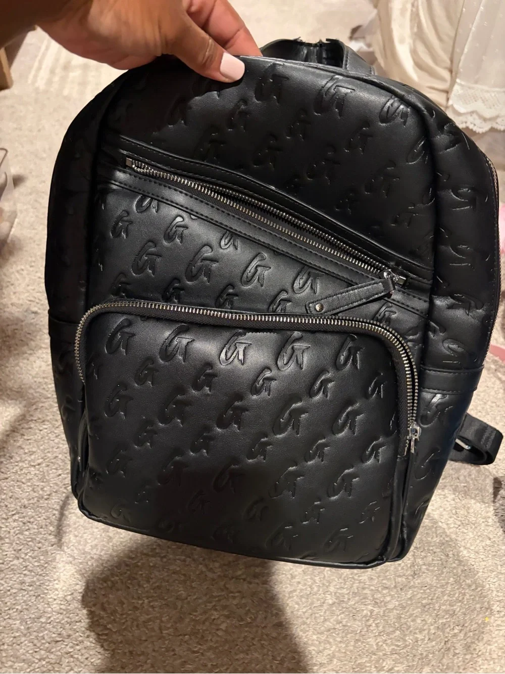 Monogram-Embossed Black Mini Backpack - Sleek Everyday Carry